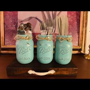 Mason jar utensil holder with a stand.